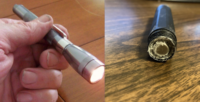 how to remove corroded battery from flashlight